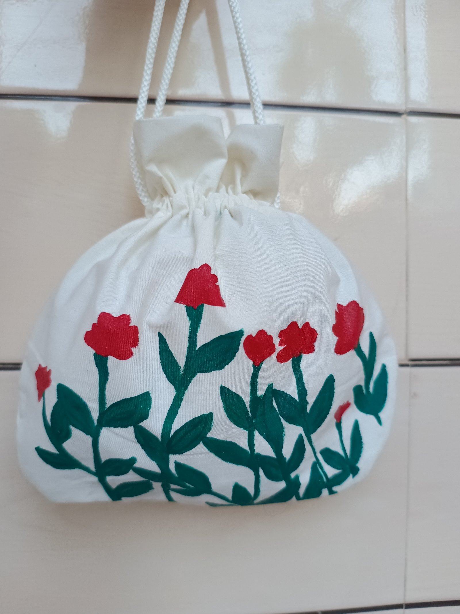 Traditional hand-painted potli bag for weddings